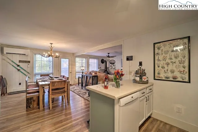 a view of a hallway with paintings on the wall