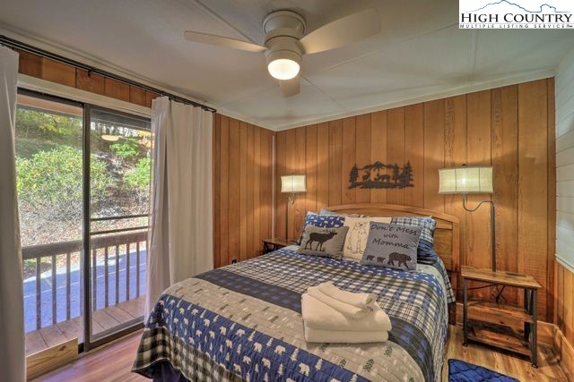 220 Charter Hills Road, Unit B2 Beech Mountain, NC 28604 - Photo 19 of 37 a bedroom with a bed and wooden floor