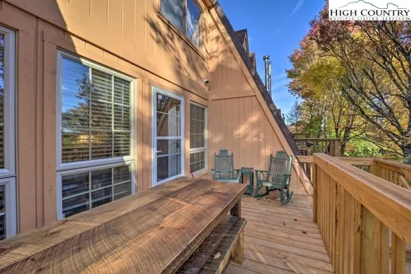 a balcony with view of outdoor space