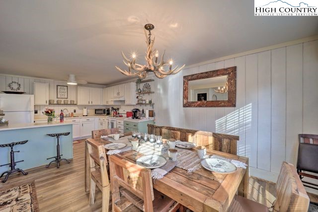 220 Charter Hills Road, Unit B2 Beech Mountain, NC 28604 - Photo 27 of 37 a view of a dining room with furniture