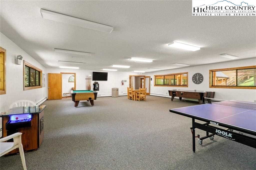 220 Charter Hills Road, Unit B2 Beech Mountain, NC 28604 - Photo 35 of 37 a living room with furniture and a table