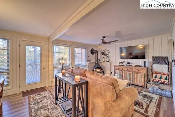 a living room with furniture and a flat screen tv