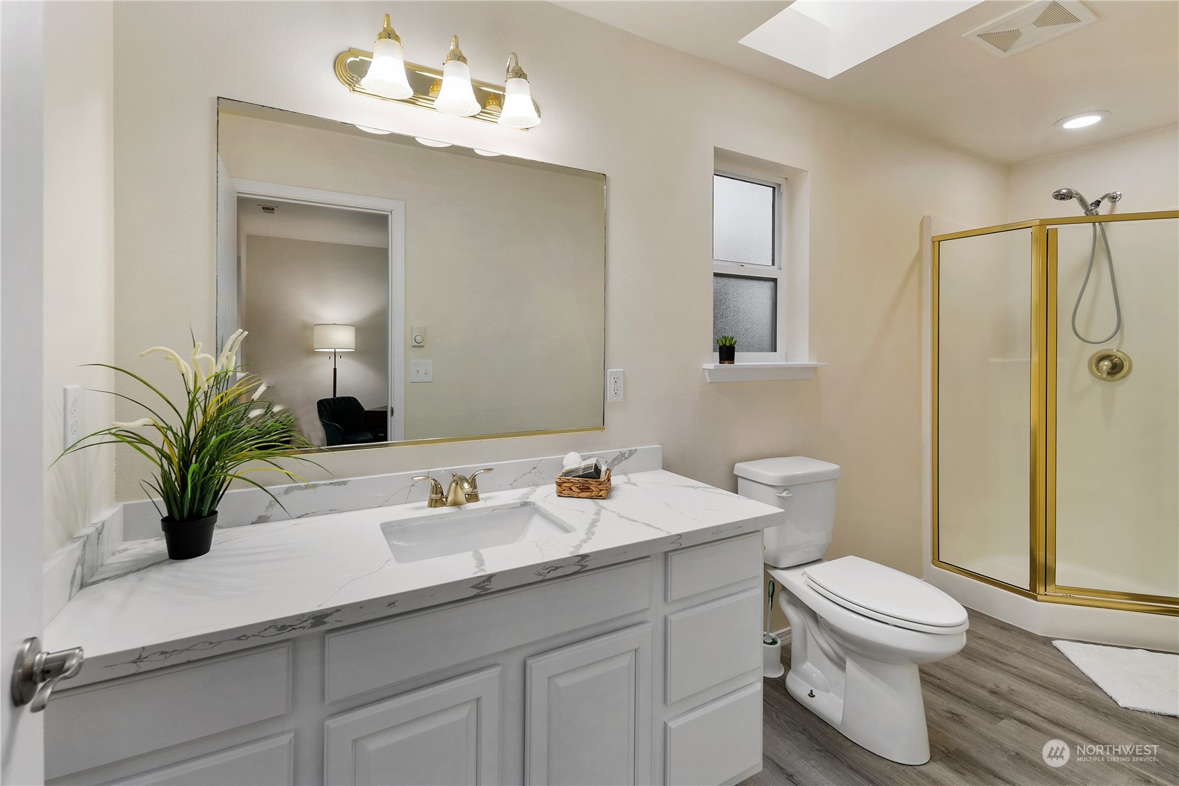 26318 127th Avenue Southeast Kent, WA 98030 - Photo 19 of 40 a bathroom with a sink a toilet a mirror and shower