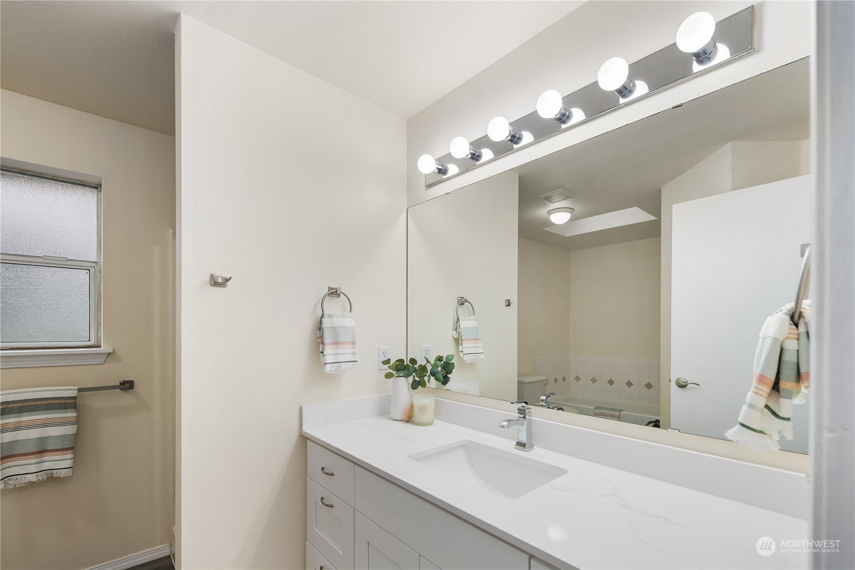 26318 127th Avenue Southeast Kent, WA 98030 - Photo 24 of 40 a bathroom with a sink double vanity and a mirror