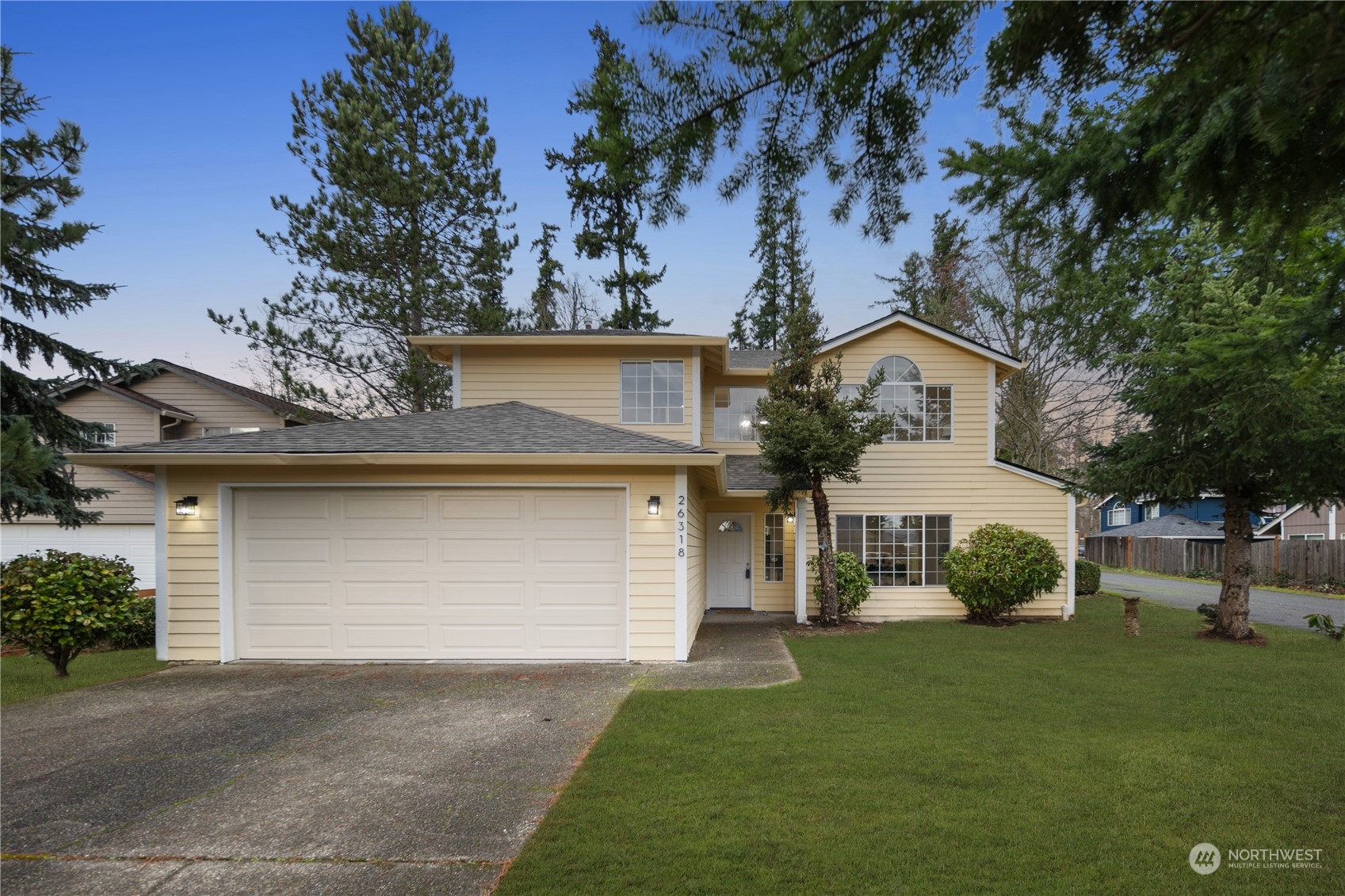 26318 127th Avenue Southeast Kent, WA 98030 - Photo 36 of 40 front view of a house with a garden
