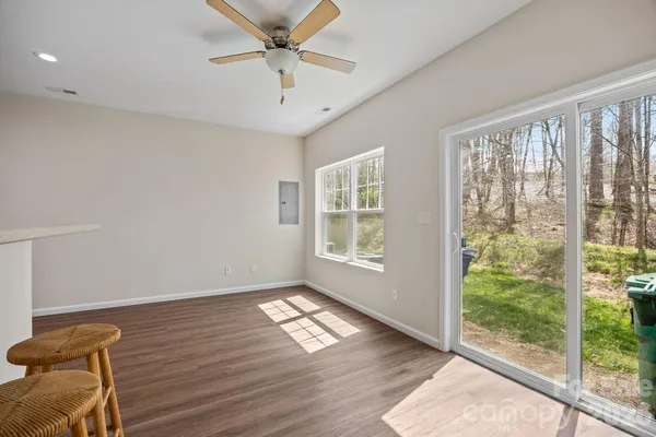 a view of a room with wooden floor