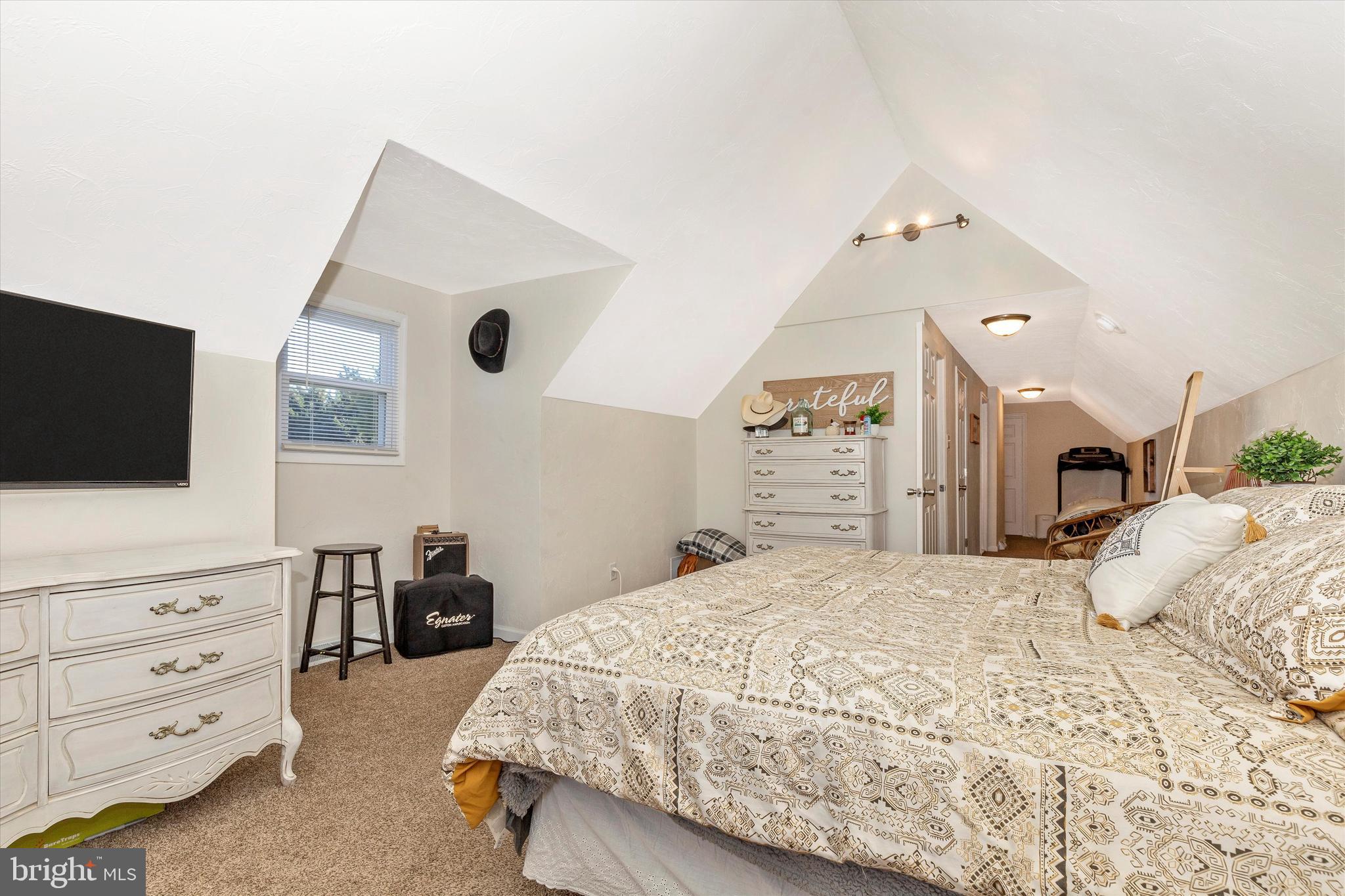 47 Pheasant Ridge Road Hanover, PA 17331 - Photo 25 of 35 a spacious bedroom with a bed and a flat screen tv