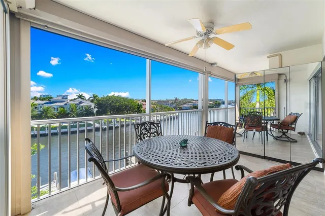 a view of a balcony with a table and chairs