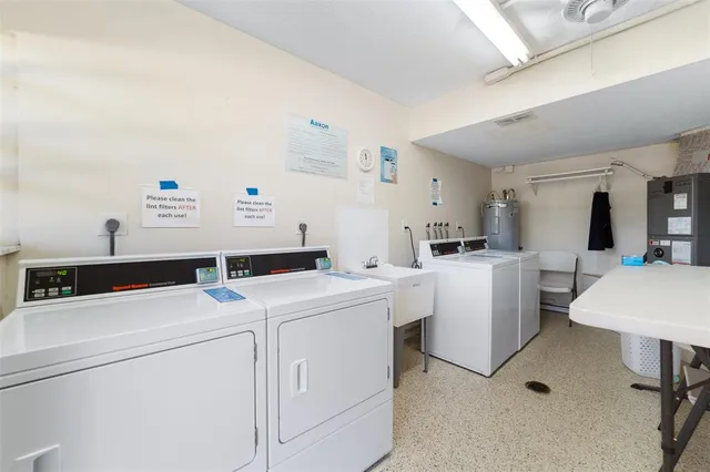 a view of a swimming pool with a garden and plants