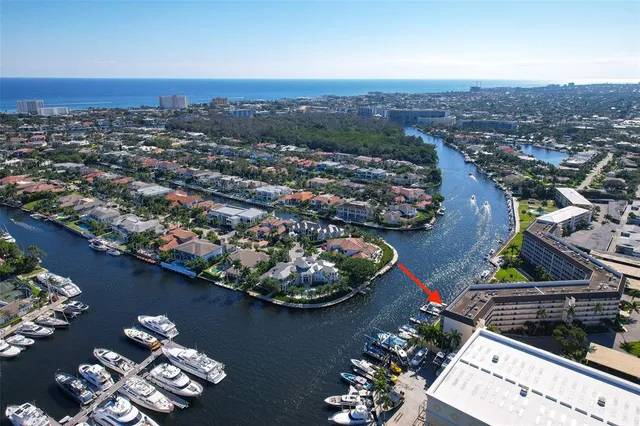 an aerial view of a house with a lake view