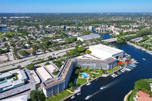 an aerial view of a residential houses with city view