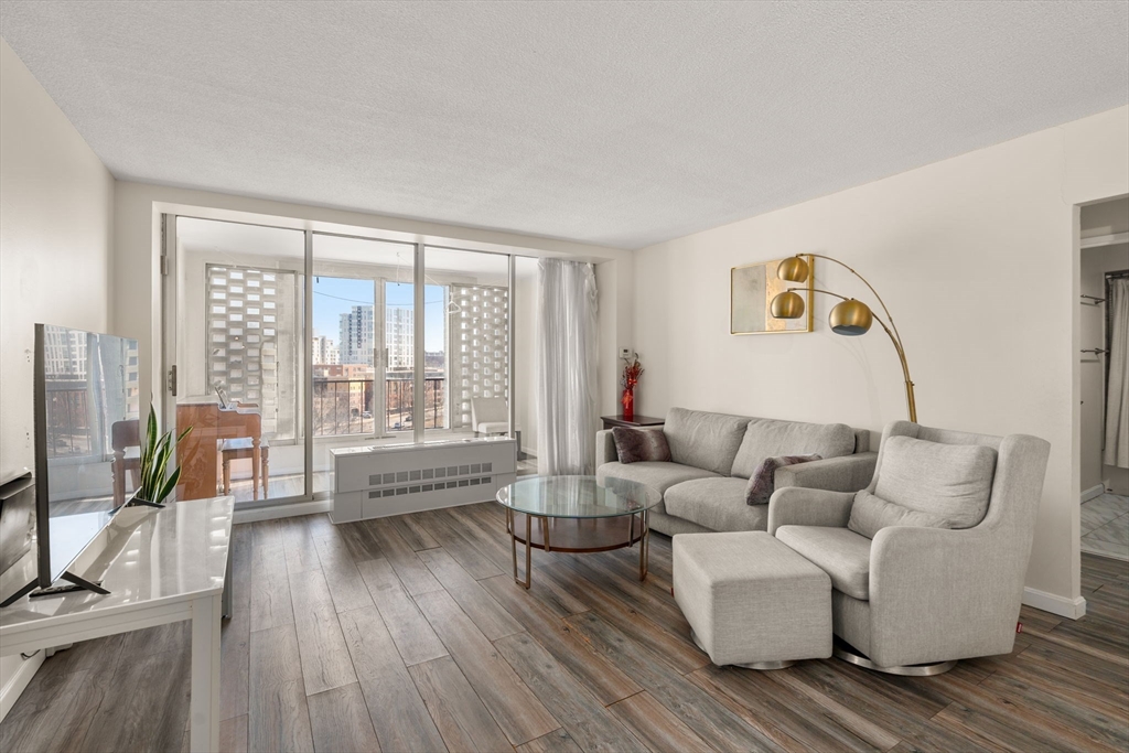 a living room with furniture and a large window