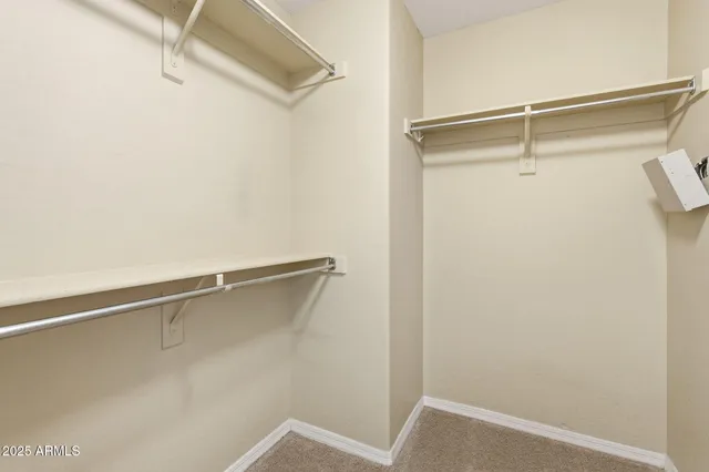 a bathroom with a double vanity sink mirror and shower