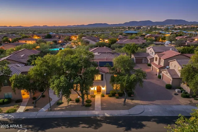 a view of a yard with wooden fence