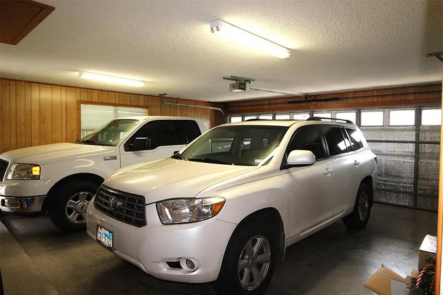 a car and bike parked in a garage