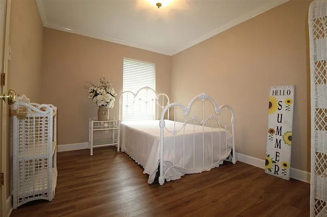 a bed room with a bed and a window