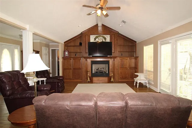 a bedroom with a bed a couch and dresser