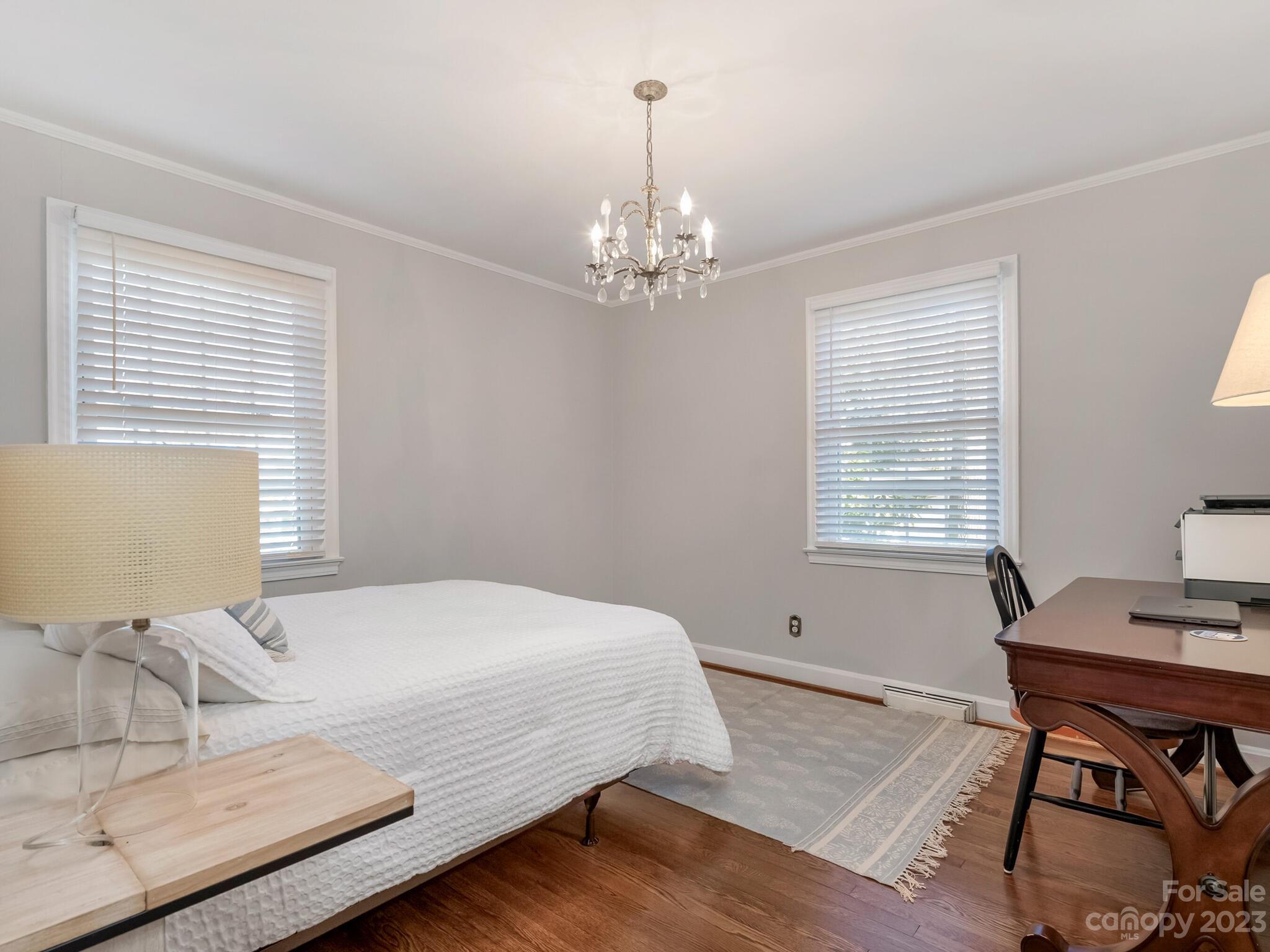 5009 Milford Road Charlotte, NC 28210 - Photo 12 of 19 a bedroom with a bed and a table