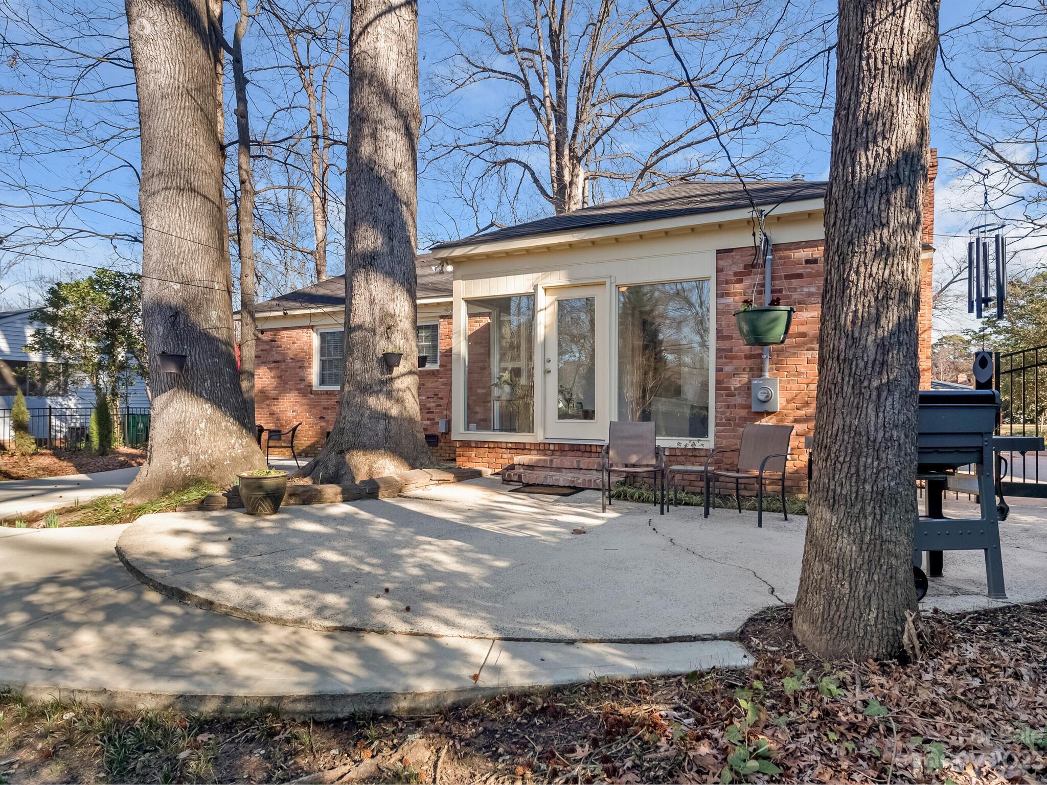 5009 Milford Road Charlotte, NC 28210 - Photo 15 of 19 a view of a building with sitting area