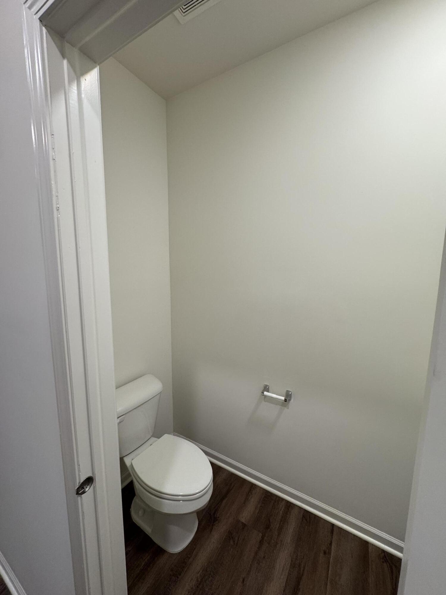 1792 East 110th Lane Crown Point, IN 46307 - Photo 6 of 17 a white toilet sitting next to a shower