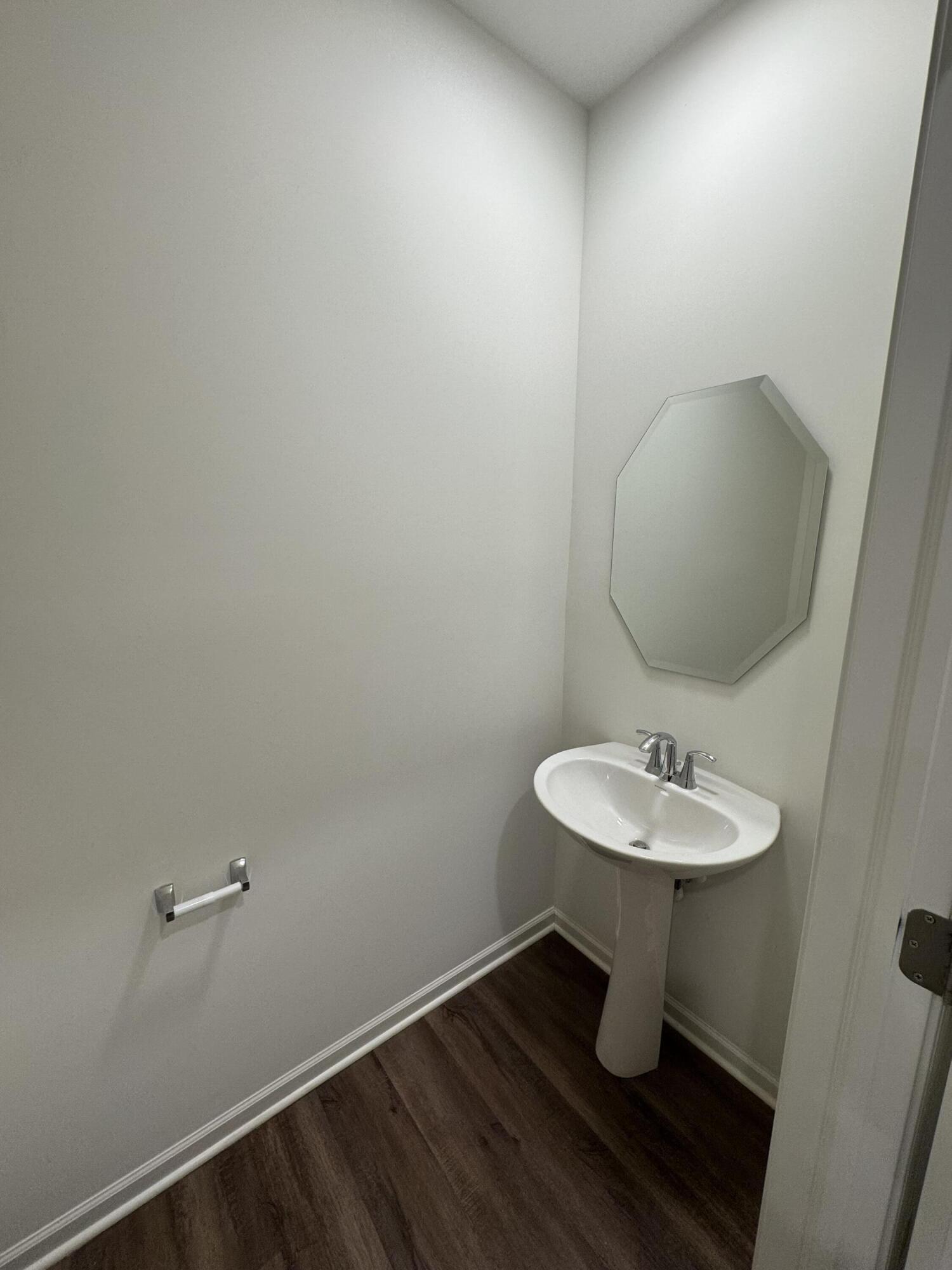 1792 East 110th Lane Crown Point, IN 46307 - Photo 7 of 17 a bathroom with a sink toilet and mirror