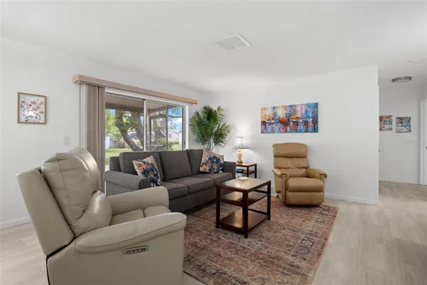 a living room with furniture and a window