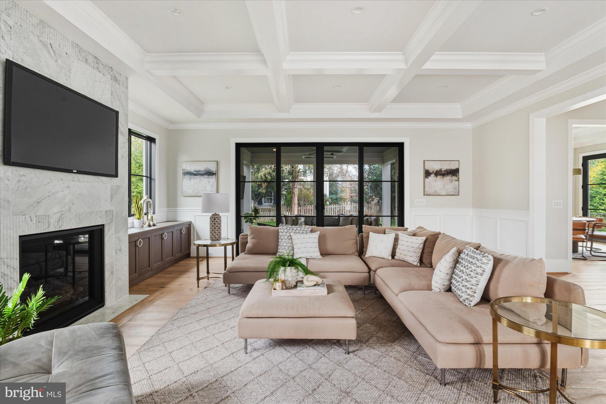 5908 Calla Drive McLean, VA 22101 - Photo 12 of 66 a living room with furniture a flat screen tv and a fireplace