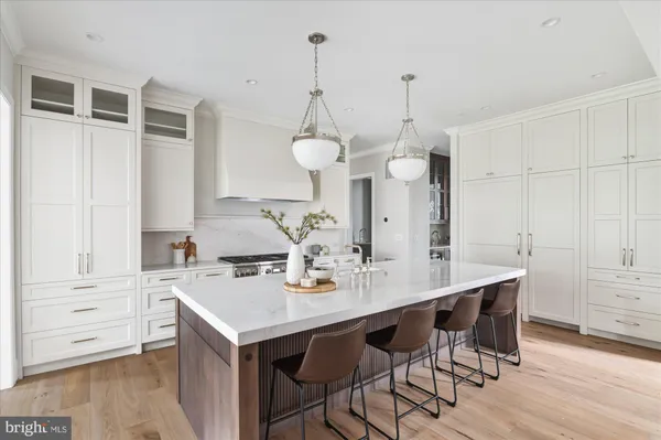 a kitchen with stainless steel appliances granite countertop a stove and a sink