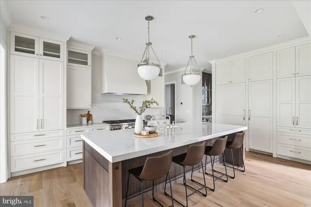 a kitchen with stainless steel appliances granite countertop a stove and a sink