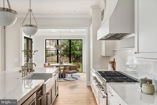 a kitchen with a refrigerator and a sink