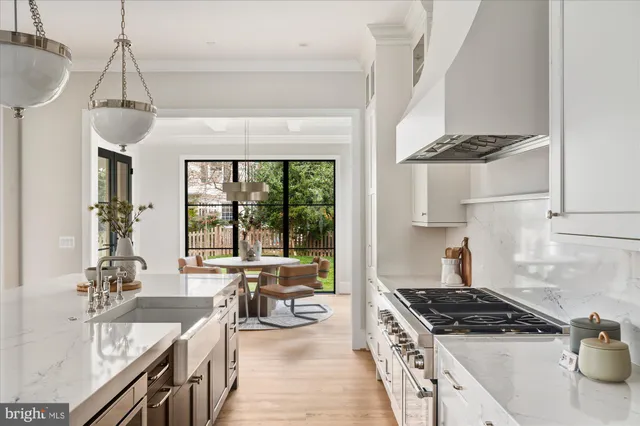 a kitchen with a refrigerator and a sink