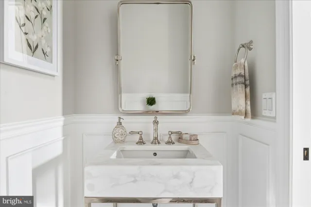 a view of hallway with furniture and window