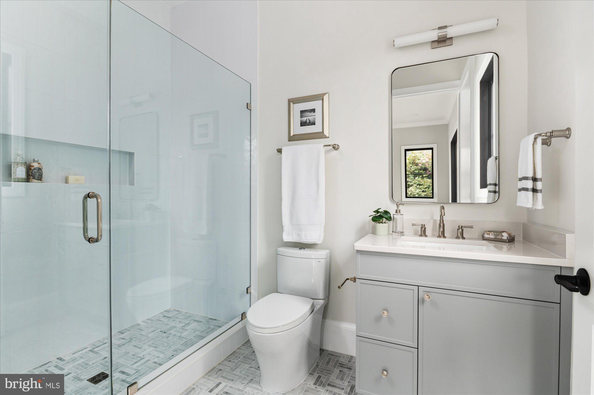 5908 Calla Drive McLean, VA 22101 - Photo 25 of 66 a bathroom with a toilet sink and shower