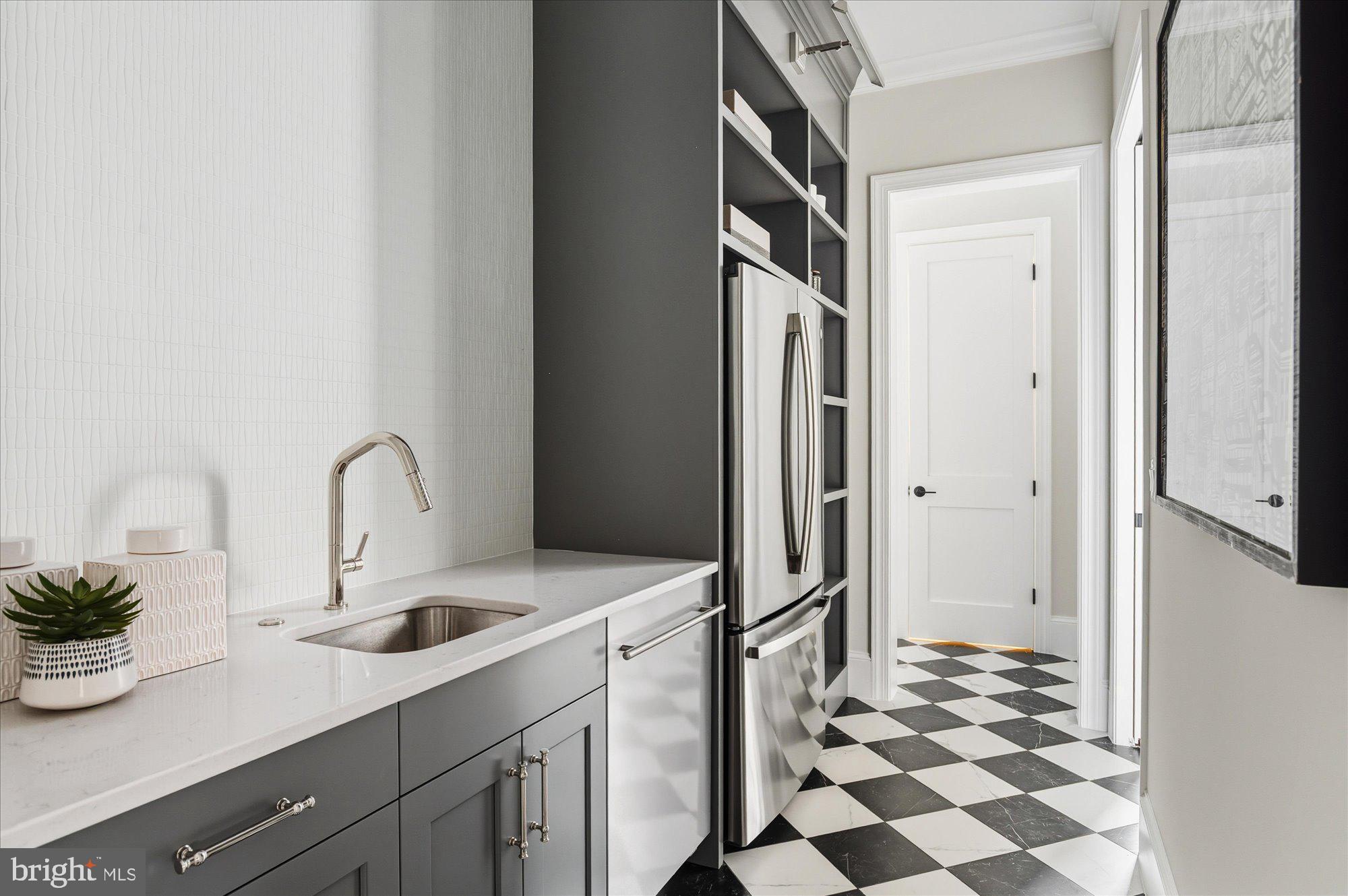 5908 Calla Drive McLean, VA 22101 - Photo 26 of 66 a kitchen with a refrigerator and a sink