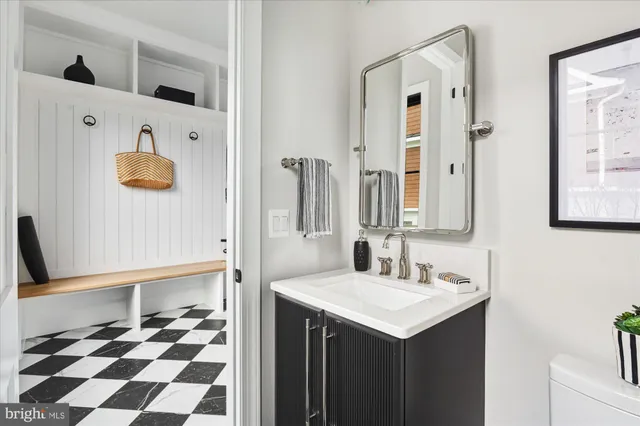 a spacious bedroom with a bed and a flat screen tv