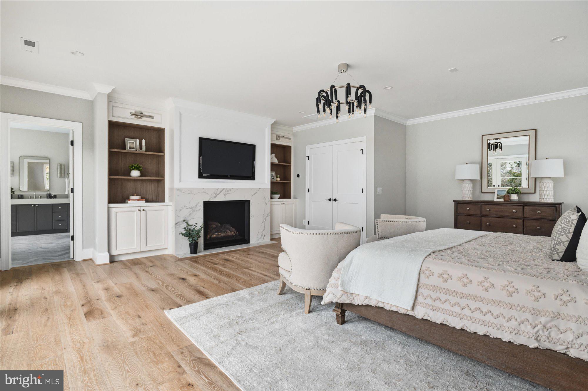 5908 Calla Drive McLean, VA 22101 - Photo 36 of 66 a spacious bedroom with a bed and a flat screen tv