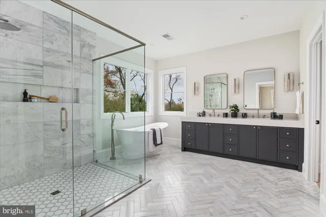 an empty room with a window and a ceiling fan