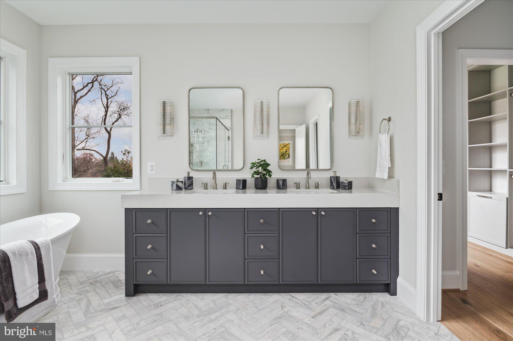 5908 Calla Drive McLean, VA 22101 - Photo 40 of 66 a bathroom with a double vanity sink mirror and double