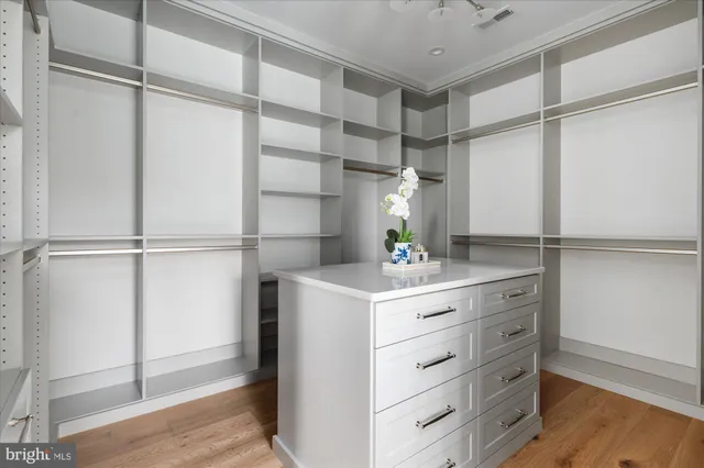 a view of kitchen with stainless steel appliances granite countertop cabinets and window