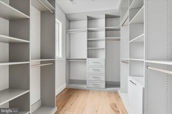 an empty room with a empty space and a ceiling fan