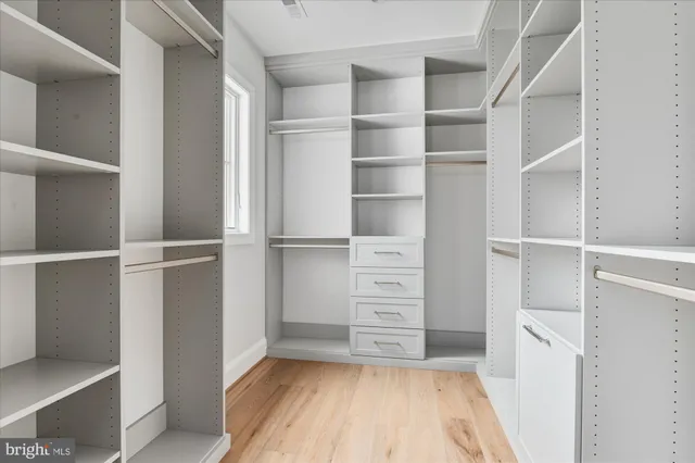 an empty room with a empty space and a ceiling fan