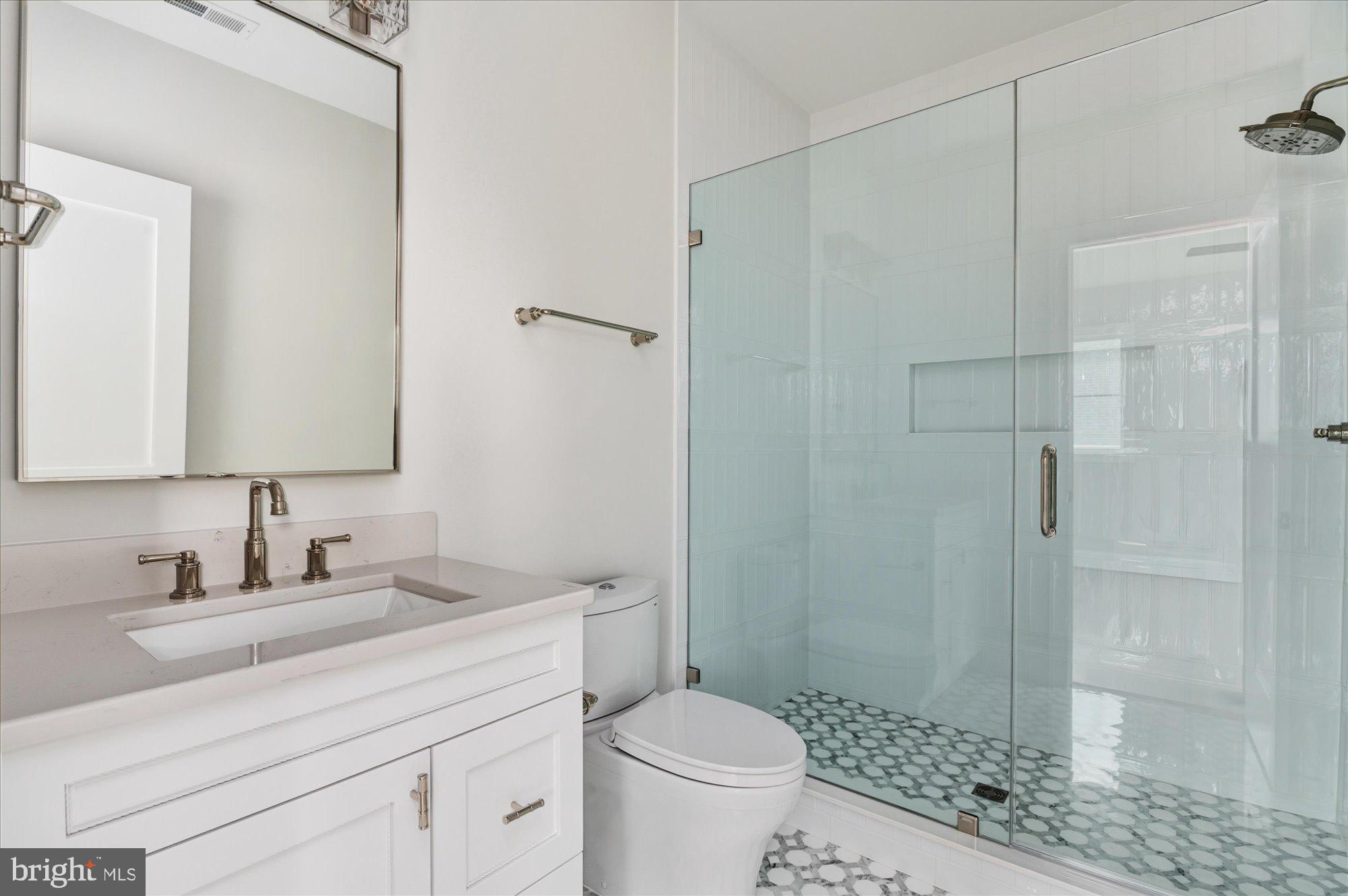 5908 Calla Drive McLean, VA 22101 - Photo 47 of 66 a bathroom with a sink toilet and shower