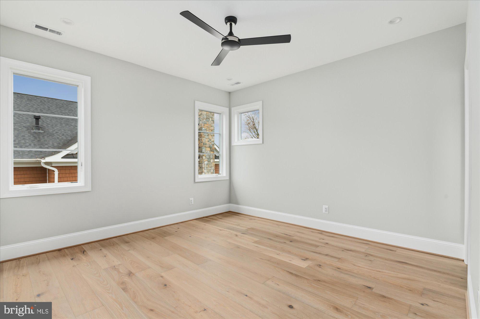 5908 Calla Drive McLean, VA 22101 - Photo 49 of 66 an empty room with a window and a ceiling fan