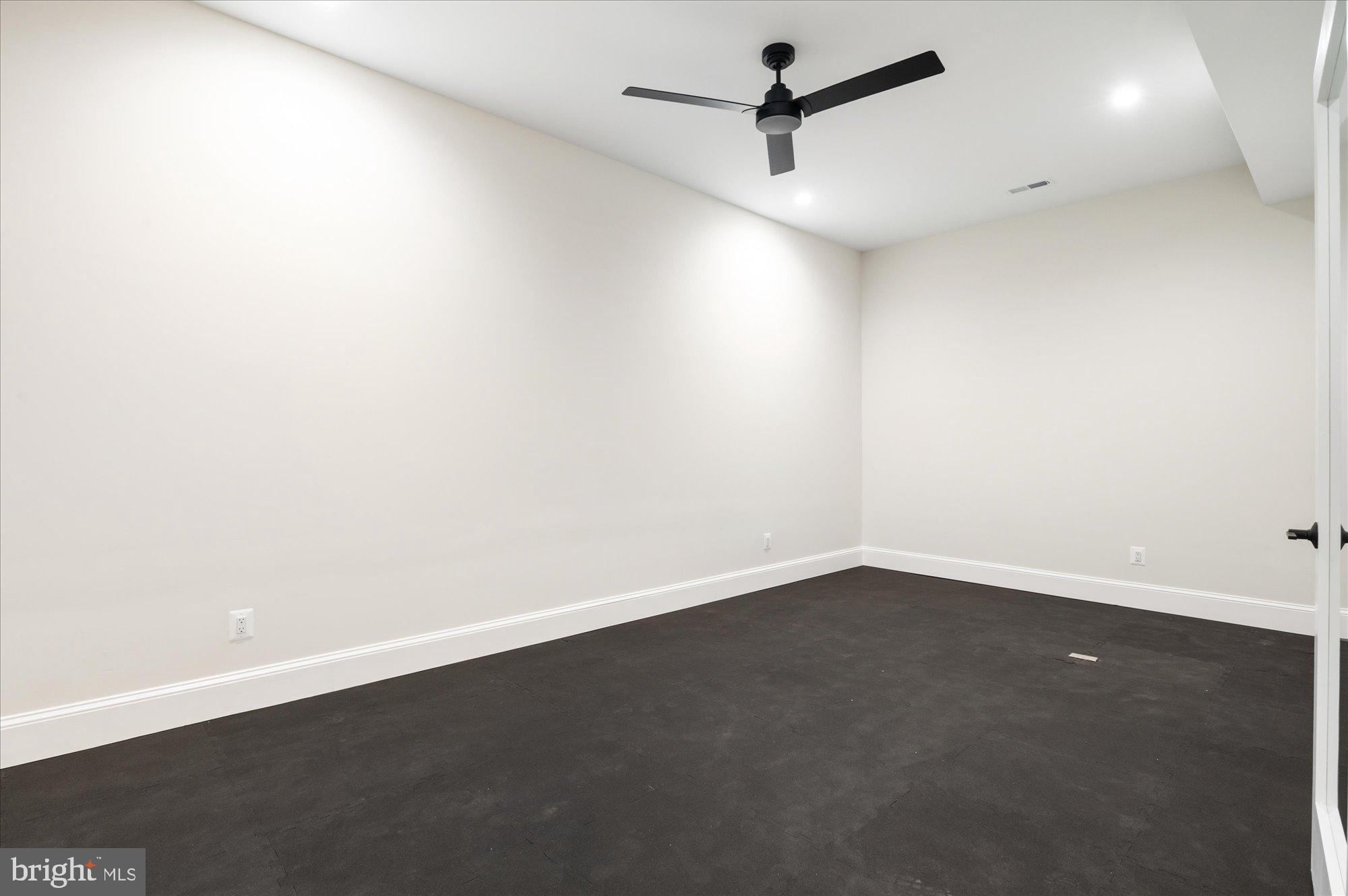 5908 Calla Drive McLean, VA 22101 - Photo 56 of 66 an empty room with a empty space and a ceiling fan