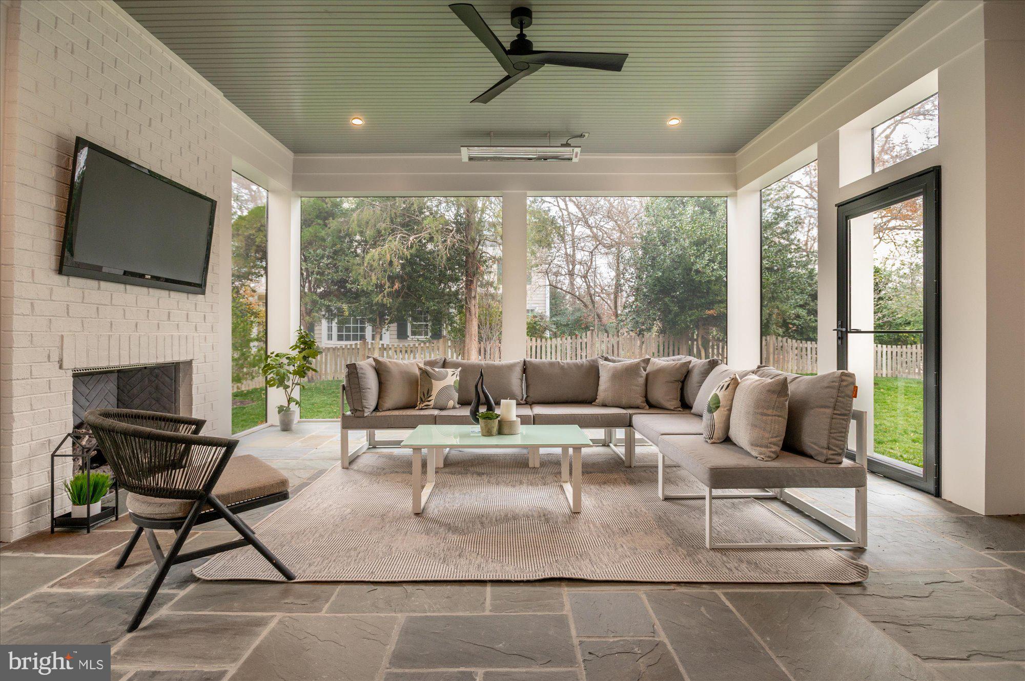 5908 Calla Drive McLean, VA 22101 - Photo 59 of 66 a living room with patio furniture and a flat screen tv