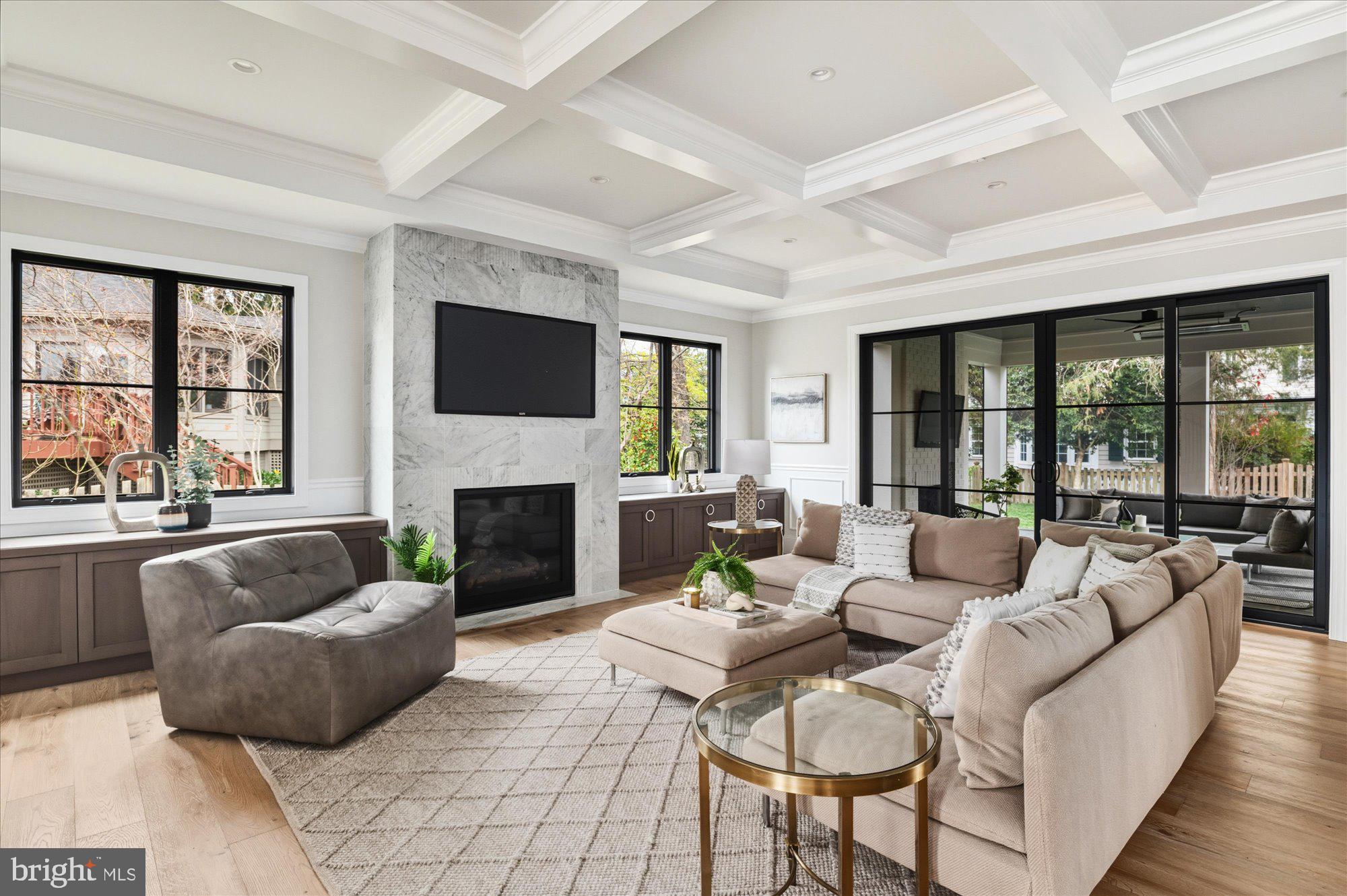 5908 Calla Drive McLean, VA 22101 - Photo 10 of 66 a living room with furniture a fireplace and a large window