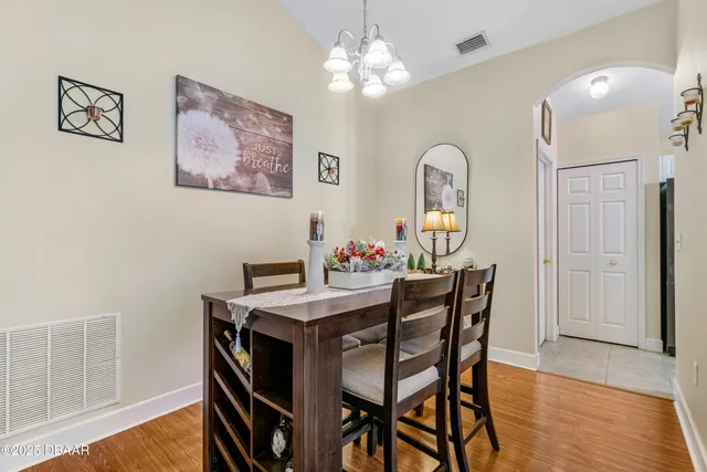a kitchen with stainless steel appliances granite countertop a sink dishwasher and a stove with white countertops