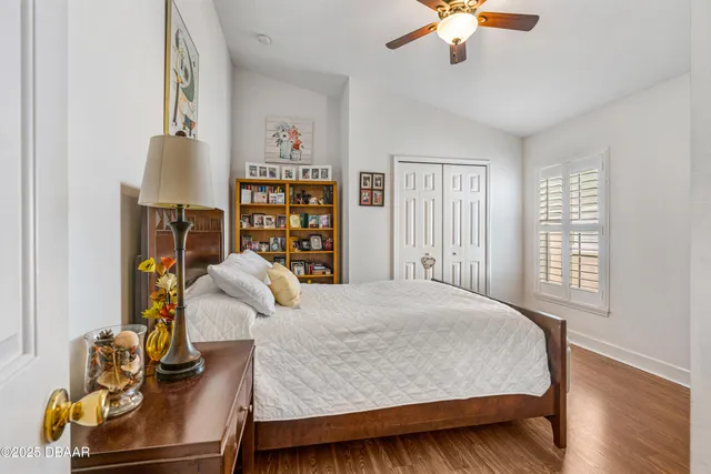 a bedroom with a bed and a cabinet
