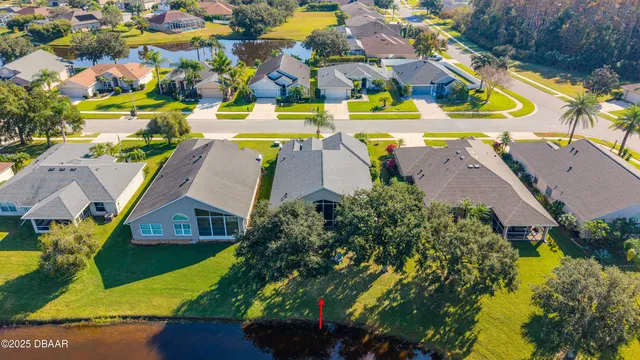 an aerial view of a house with a swimming pool yard and outdoor seating