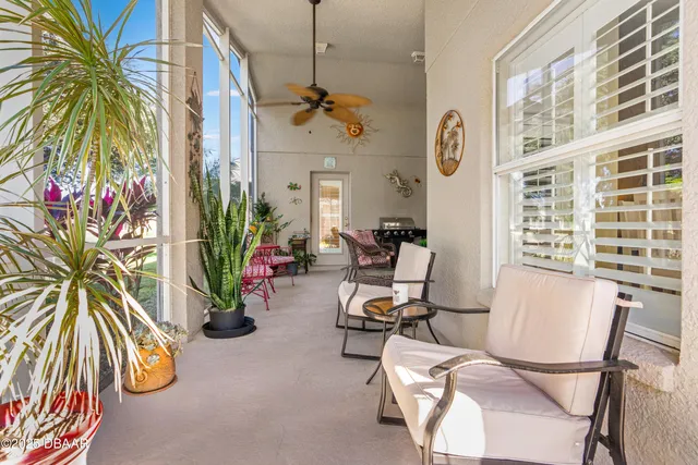 a living room with furniture a rug and a window